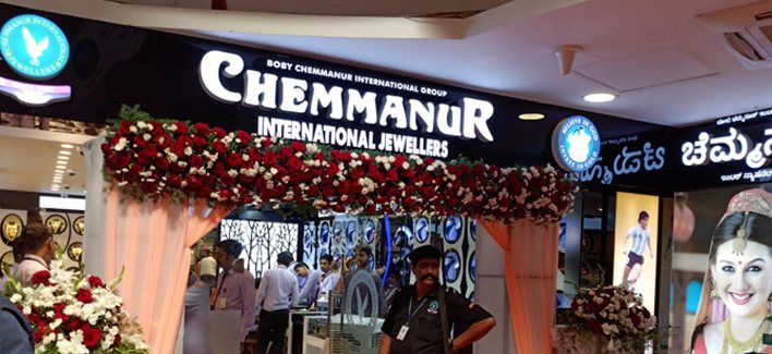 A Chemmanur International Jewellers showroom — the gold signboard at a new city opening